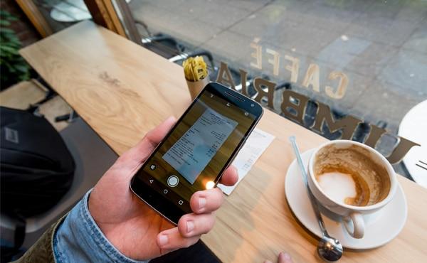 Photo of receipt being taken with phone